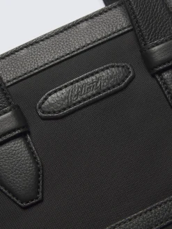Black nylon and grained leather garment bag