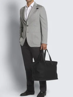 Black nylon and grained leather city bag
