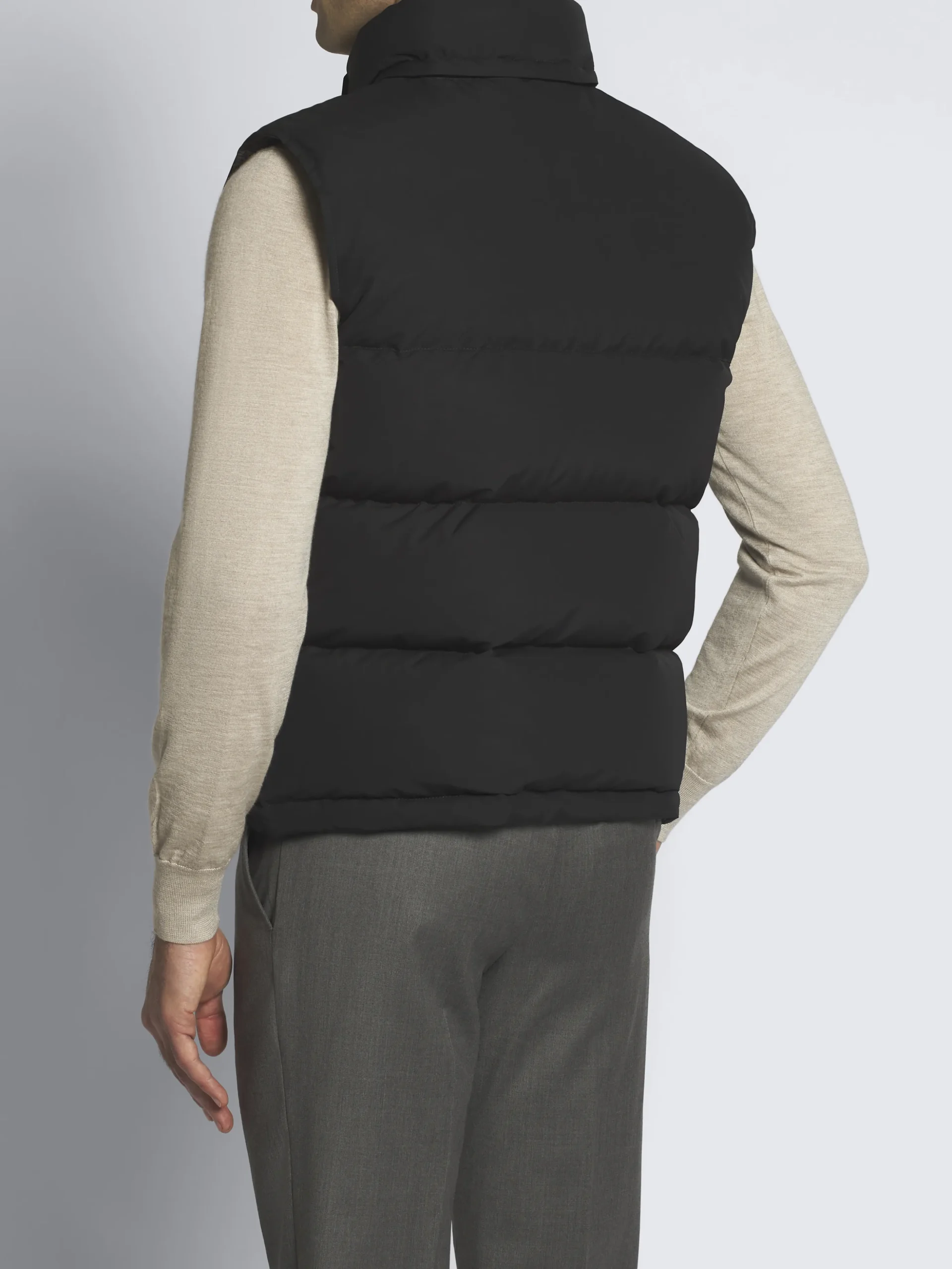 Black quilted and padded vest in technical wool