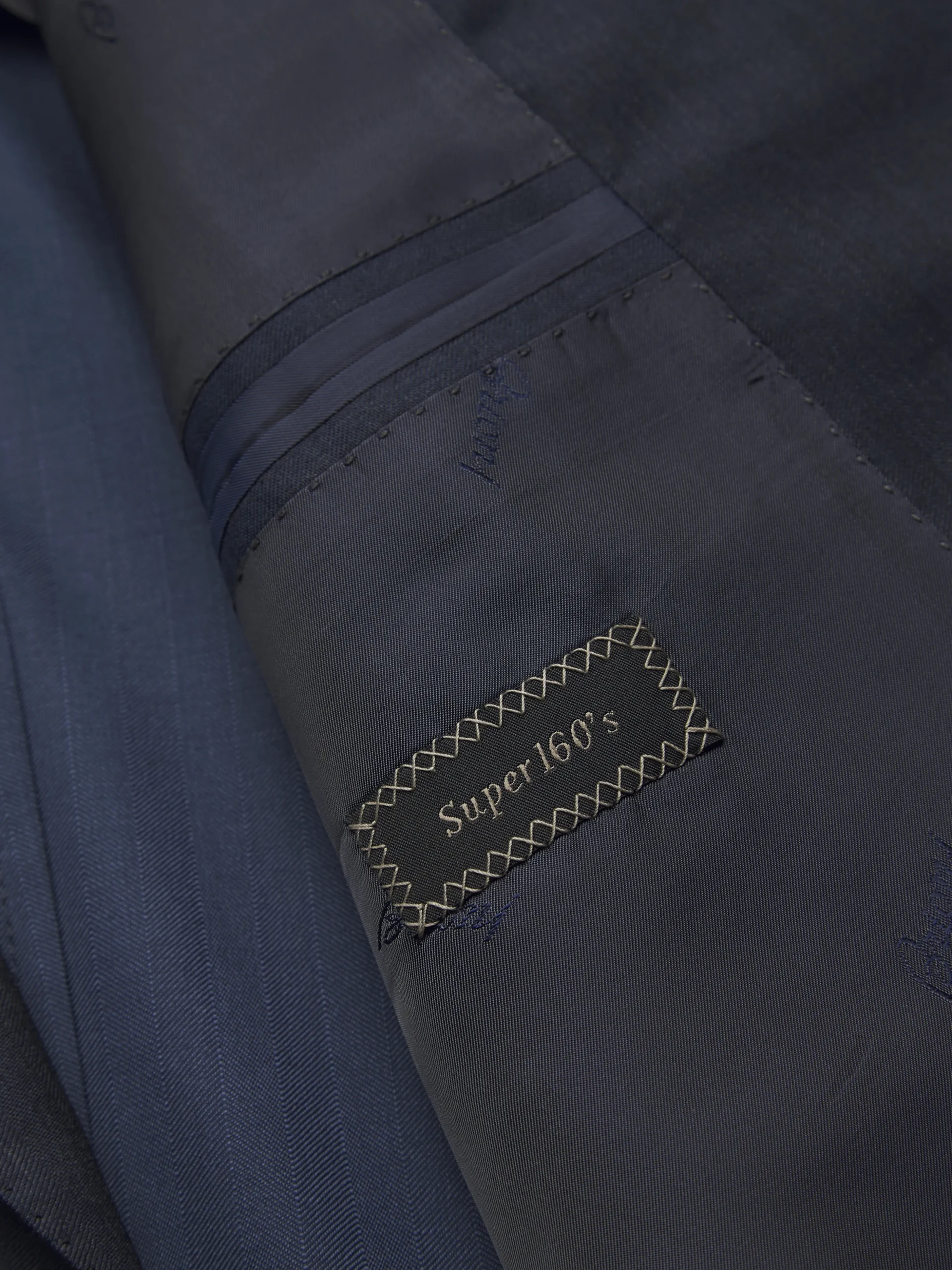 Navy blue herringbone Super 160's wool Brunico suit